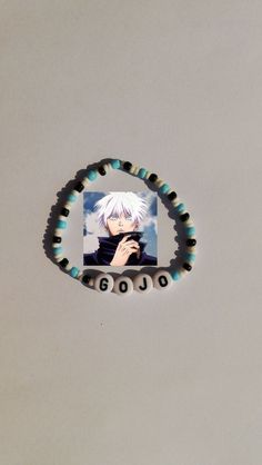 a beaded bracelet with an anime character on it