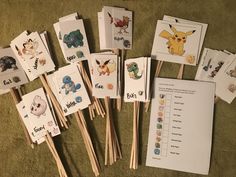 several different types of toothpicks on the ground with pictures and words attached to them