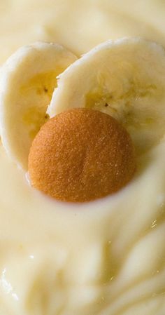 a dessert with bananas and cream on it's side is seen in this image