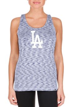 a woman wearing a tank top with the los angeles dodgers on it's chest