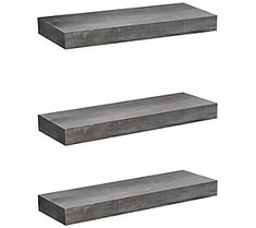 three shelves made out of concrete are shown