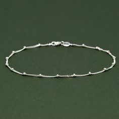 Genuine 925 Sterling Silver Beaded Curb Bracelet 92.5% Pure Sterling Silver - thin, fine, & delicate beaded curb chain bracelet. 1mm diamond-cut curb chain with beads sent at every 2cm, bolt ring fastening. Introducing our exquisite Sterling Silver Beaded Curb Chain Bracelet. This dainty and delicate piece of jewellery is the perfect addition to any outfit, adding a touch of elegance and sophistication to your overall look. The minimalist design of this bracelet makes it a versatile accessory that can be worn on any occasion. Crafted from high-quality sterling silver, this bracelet features a beaded curb chain that adds a subtle texture and shine. The sterling silver material ensures durability, while also giving it a timeless and classic look. This bracelet is not only a beautiful piece o Meaningful Gifts For Her, Minimalist Jewellery, Curb Chain Bracelet, Bolt Ring, Bracelet Minimalist, Bracelet Dainty, Dainty Bracelet, Dainty Bracelets, Jewellery Gift