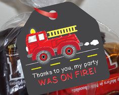 a firetruck birthday party bag for someone's first birthday with the name thank you, my party was on fire