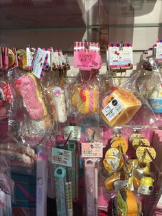 there are many items on display in the store window, including toothbrushes and other things