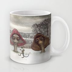 a coffee mug with two mushrooms and a cat in the snow, on a white background