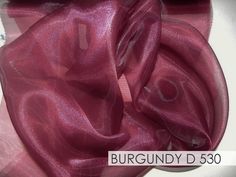 a close up of a purple colored fabric on a table cloth with the words burgundy d 350