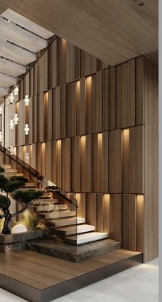 an elegant staircase in a modern building with wood paneling on the walls and floor