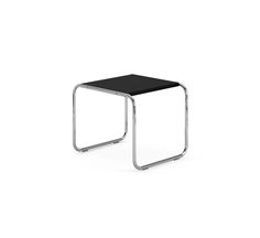 a small black table sitting on top of a white floor next to a metal frame