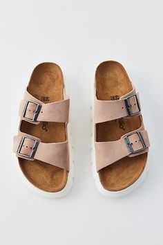 Suede Birkenstock Arizona sandals updated with a chunky flatform lug sole. Features Birkenstock Arizona chunky suede sandals An update to the iconic Birkenstock sandals Double-strap upper Contoured cork footbed Plenty of comfy arch support Deep lugged sole Slip-on style Content + Care Suede, cork, rubber Spot clean Imported Size + Fit Platform: 1.5" | Birkenstock Arizona Chunky Suede Sandal in Warm Sand, Women's at Urban Outfitters Trendy Footbed Sandals With Cork-bed Midsoles, Trendy Footbed Sandals With Cork-bed Midsoles And Round Toe, Casual Footbed Sandals With Chunky Platform And Round Toe, Casual Open Toe Footbed Sandals With Chunky Platform, Trendy Leather Footbed Sandals With Cork-bed Midsoles, Spring Footbed Sandals With Round Toe And Lug Sole, Trendy Flat Heel Sandals With Leather Footbed, Summer Suede Platform Footbed Sandals, Suede Platform Footbed Sandals For Spring