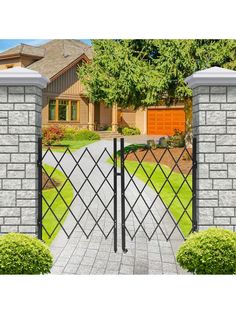 an iron gate with two gates on each side and a driveway in the other direction