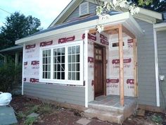 a house being built with the front door open