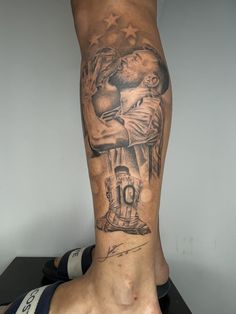 a man's leg with a tattoo on it