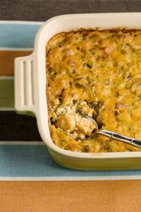 a casserole dish filled with chicken and cheese