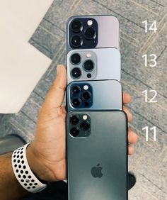 someone holding up their new iphones in front of the camera