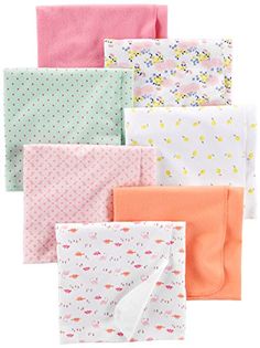 six folded napkins in different colors and patterns on white background with polka dot design