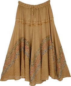 A brown clay colored skirt in soft and flowy rayon fabric, embellished with a net-like fine embroidery in the lower half and is highlighted with three wavy bands of stonewashed floral fabric in green, red and blue with overlaying floral embroidery. The long skirt is comfortable and flexible with its elastic waist with a drawstring allowing for size adjustments. #tlb #Embroidered #Misses #MaxiSkirt #bohemianfashion #RenaissanceSkirt #Rayonlongskirt #costumeskirt #fairycoreskirt Bohemian Brown Cotton Skirt, Bohemian Brown Flared Skirt, Bohemian Rayon Skirt For Festival, Bohemian Embroidered Flared Skirt, Bohemian Flowy Skirt With Floral Embroidery, Fitted Bohemian Rayon Skirt, Bohemian Skirted Bottoms In Brown, Brown Flowy Bohemian Skirt, Bohemian Brown Flowy Skirt