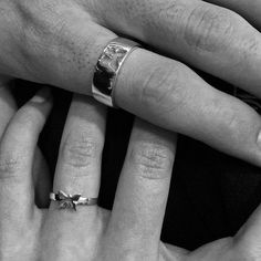 two hands with wedding rings on their fingers