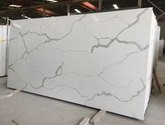 a large white marble slab in a warehouse