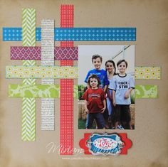 a scrapbook page with an image of two boys and a cross on the cover