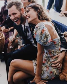 a man and woman sitting next to each other