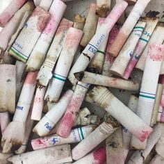 a pile of white and pink crayons sitting on top of each other