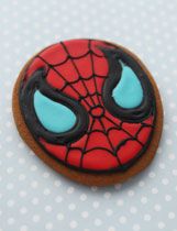 a cookie decorated with the shape of a spider - man