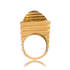 A stunning vintage citrine cocktail ring set in a beautiful Retro 18k yellow gold mounting. This mid-century ring is artfully sculpted with graduated concentric lines that lead to the citrine.
Circa 1940.
If you have any questions about this ring, please feel free to contact us.