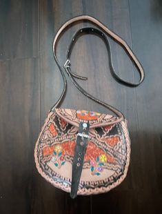 "Mexican leather bag. Cow Leather Bag. Engraved bag. Hand engraved and hand painted bags with a beautiful handcrafted work. Very durable and timeless. With an excellent work by Mexico's artisan hands. The sizes are: Handle length 49\" long 10.5\" height 8\"  width 4.5\"" Vintage Hand Painted Rectangular Bag, Hand Painted Leather Tote Shoulder Bag, Hand-painted Leather Tote Shoulder Bag, Hand Painted Brown Shoulder Bag Gift, Leather Hand Painted Crossbody Bag, Hand Painted Leather Crossbody Bag, Hand Painted Satchel Bag For Everyday Use, Traditional Leather Satchel With Adjustable Strap, Unique Leather Bag As A Gift