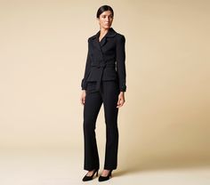 "Cut for a flattering slim-fit, this double breasted black blazer is crafted from a lightweight, luxurious viscose fabric. Complete with a cloverleaf lapel and finished with two-button cuffs - this blazer comes with the option of matching fitted pencil tuxedo pants, to form a womens suit. Jacket: - fitted silhouette - peplum style - cloverleaf lapel - double breasted closure - fabric buttons - matching fabric belt with buckle - fully lined Pants: - high rise - straight style - hook&loop + zi Chic Tailored Pantsuit With Suit Collar, Chic Double-breasted Formal Pantsuit, Fall Workwear Pantsuit With Suit Collar, Office Lady Pantsuit For Fall, Fall Office Lady Pantsuit, Elegant Business Casual Pantsuit With Double Button, Fall Lapel Collar Pantsuit For Work, Chic Business Pantsuit With Lapel Collar, Fall Workwear Pantsuit With Lapel Collar