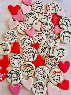 a pile of decorated cookies sitting on top of a table