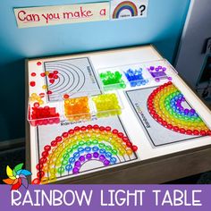 the rainbow light table is set up for children to play