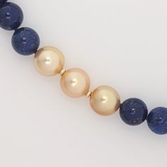 Discover the elegance of this stunning necklace featuring top-tier Golden South Sea pearls, complemented by a 14K yellow gold rondelle beads. This extraordinary piece combines high-quality Lapis Lazuli beads with these three amazing Golden pearls, and finished with out favorite 14K yellow gold interlocking clasp to create a harmonious blend of luxury and style. Measuring 19.5 inches (approximately 50cm), this necklace is designed for both comfort and beauty. Our Golden South Sea pearls are cultu Elegant Yellow Gold Beaded Necklaces With Round Beads, Elegant Yellow Gold Pearl Necklace With Polished Beads, Elegant Yellow Gold Beaded Necklace With Gemstones, Luxury Pearl Necklace With Gemstone Beads, Gold Hand-strung Pearl Necklace With Round Beads, Elegant Gold Hand-strung Beaded Necklaces, Elegant Hand-strung Gold Beaded Necklaces, Elegant Formal Pearl Necklace With Natural Stones, Elegant Formal Pearl And Gemstone Necklace