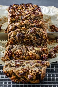 a loaf of pecan bread sitting on top of a cooling rack