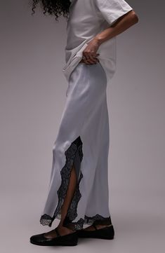 A slinky biax-cut satin maxi skirt gets a lilt of lace at the hemline and side slit to create a sweet and spicy look that will turn heads. Pull-on style 100% viscose Machine wash, line dry Imported Satin Maxi Skirt, Slip Skirt, Satin Maxi, Lace Slip, Satin Skirt, Sweet And Spicy, Black Satin, Lace Trim, Maxi Skirt