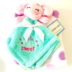 a stuffed animal on top of a blue towel