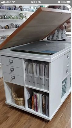 an open bookcase with many books on it in a room filled with other items