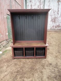 a wooden bench with three bins on it