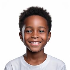 a young boy smiling for the camera with his hair styled in an afro and wearing a white t - shirt