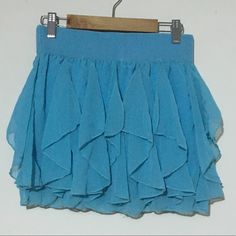 Brand New Without Tags In Perfect Condition Blue Ruffled Mini Skirt For Beach, Blue Stretch Tiered Mini Skirt, Blue Flowy Mini Skirt With Ruffles, Stretch Blue Tiered Skirt, Chic Blue Ruffled Mini Skirt, Light Blue Flowy Skirt For Party, Flowy Light Blue Party Skirt, Blue Flowy Mini Skirt, Chic Style, Light Blue Casual Mini Skirt For Party