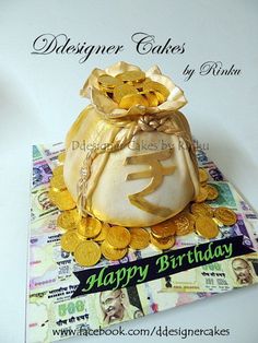 there is a bag with gold coins in it on top of a card that says happy birthday