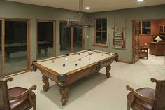 a pool table in the middle of a room