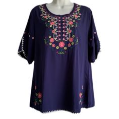 Nwt Tunic Top - Blue (Purple Blue In Direct Sun Light) - Embroidery Of Flowers On The Front, Sleeves, And Front Bottom - White Trimming Around Sleeves And The Hem Of The Top - Round Neckline - Pull Over Head Top - Short Sleeves (Sit Above Elbows) W/ A Split Opening 2” Detail - Top Hits Around Hip Level (Depending On Height) - Ethnic Appeal To The Top - Light Weight Material - Sz Medium (Shoulder To Shoulder 15.5”) Casual Purple Blouse With Floral Embroidery, Purple Floral Embroidered Crew Neck Top, Blue Short Sleeve Top With Geometric Embroidery, Casual Embroidered Purple Blouse, Purple Crew Neck Top With Floral Embroidery, Blue Embroidered Short Sleeve Top For Vacation, Purple Floral Embroidered Beach Top, Casual Purple Embroidered Blouse, Purple Floral Embroidery Beach Top