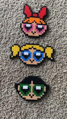 three pieces of bead art depicting cartoon characters