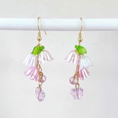 These lily of the valley wing earrings are handmade by myself.  The wires are gold plated, hypoallergenic, nickel and lead free.   If you have any questions, please ask.  If something wouldn't be right it would be by accident.  Please let me know so I can help you and make it right.  I want you to be happy! It's best to store the item in a plastic bag to keep it shiny.  I am not sure of the exact metal content of the components. Thanks so much for looking! Whimsical Gold Flower-shaped Earrings, Gold Whimsical Flower-shaped Earrings, Whimsical Gold Flower Earrings, Butterfly Cottagecore, Cottagecore Fairy, Fairy Forest, Forest Flowers, Wing Earrings, Earrings Pink