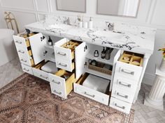 a bathroom vanity with two sinks and several drawers in front of a bathtub next to a rug