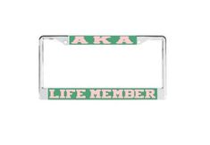 a green and white license plate frame with the words aka life member on it