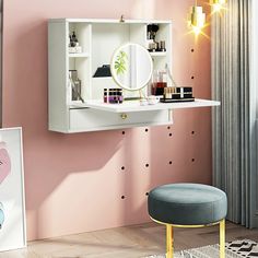 a pink room with a mirror, stool and shelf on the wall next to it