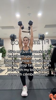 a woman is doing exercises with dumbbells in the middle of a gym room