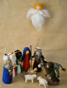 a nativity scene with figurines and angels