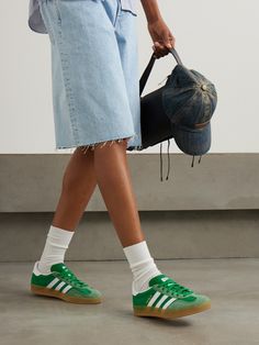 adidas Originals' 'Gazelle Indoor' sneakers were initially released in the '70s as an indoor sports shoe and have since grown to become an iconic streetwear staple. This iteration is made from green nylon with suede and leather trims and gummed rubber soles. Green Sneakers Outfit, Adidas Shoes Originals, Adidas Originals Gazelle, Cinch Bag, Indoor Sports, Adidas Originals Women, Green Sneakers, Green Shoes, Sneakers Outfit